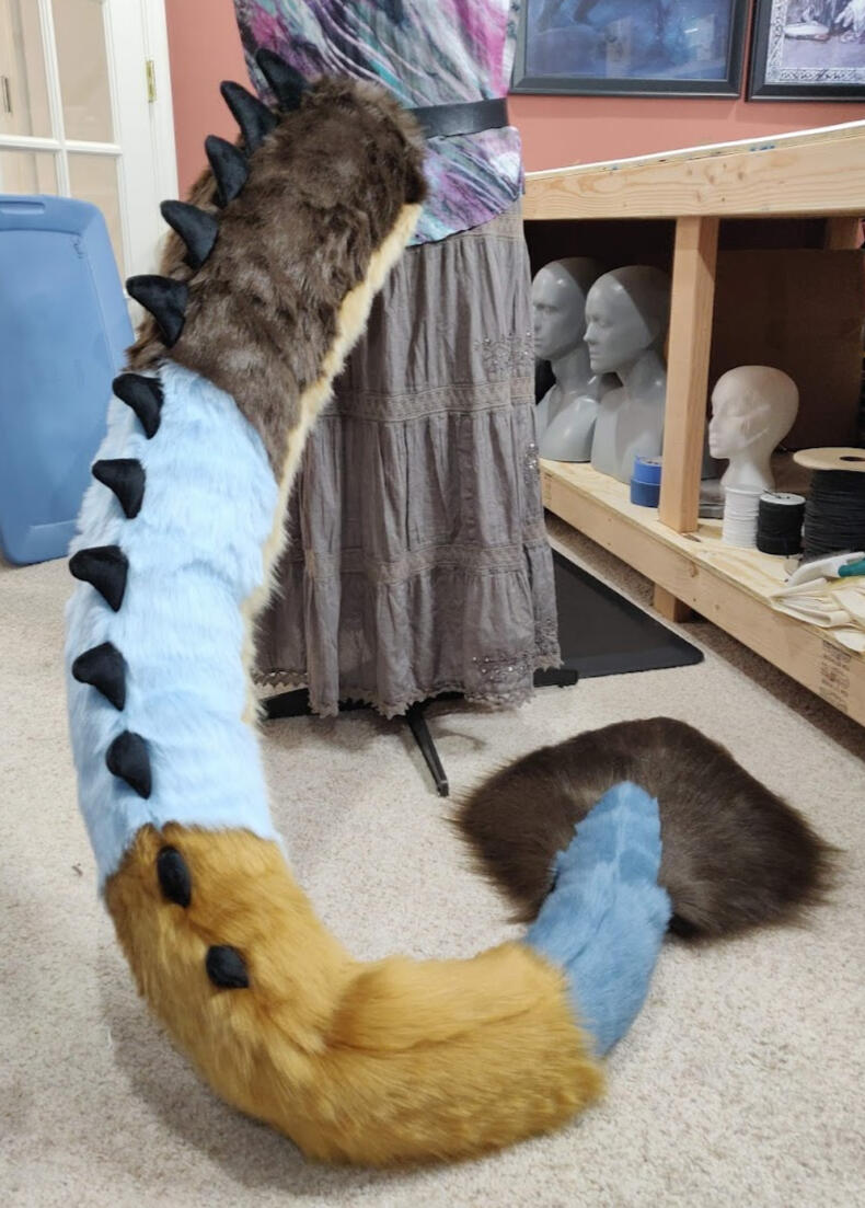Multicolor dragon floor-dragger tail with spikes and tail floof.